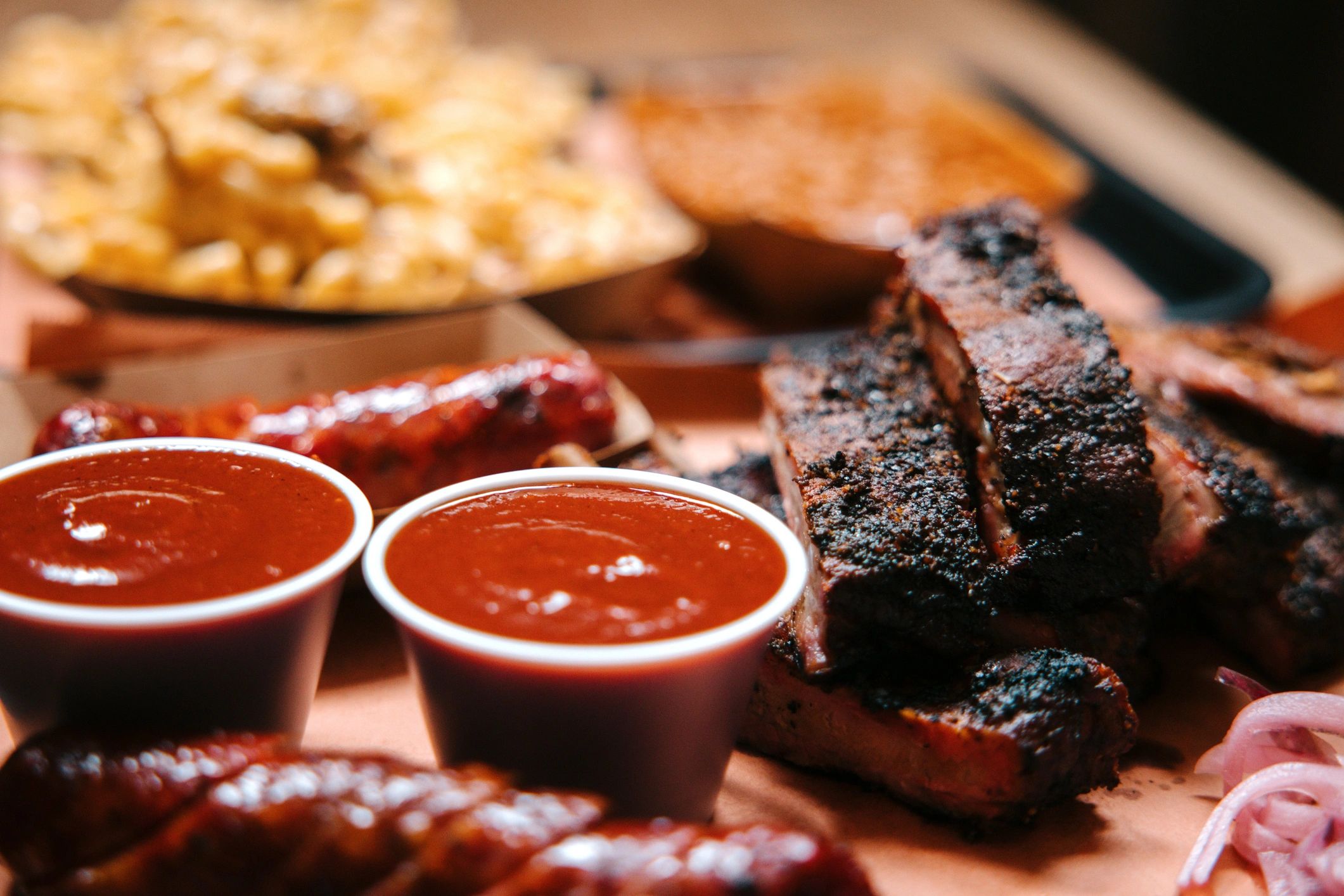 BBQ sauces in jars and bowls